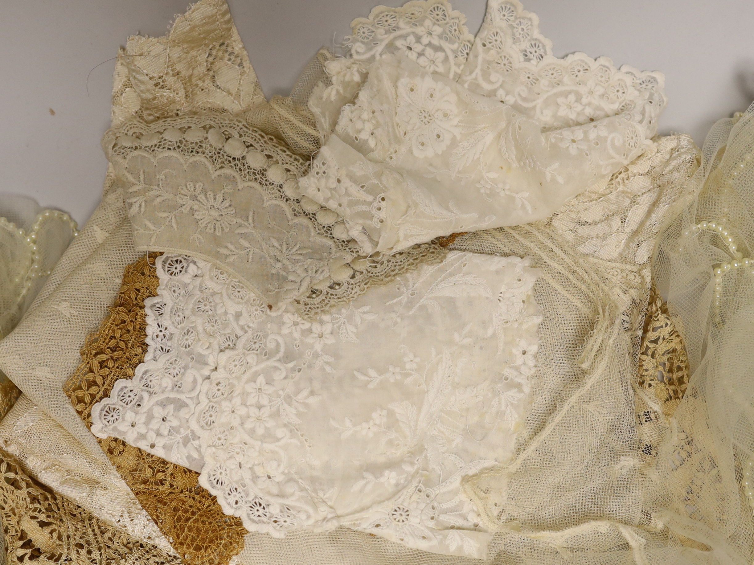 A silk Maltese lace trim, mixed lace and a pearl edged veil